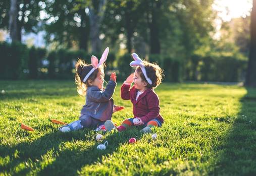 happy kids playing Easter egg hunt