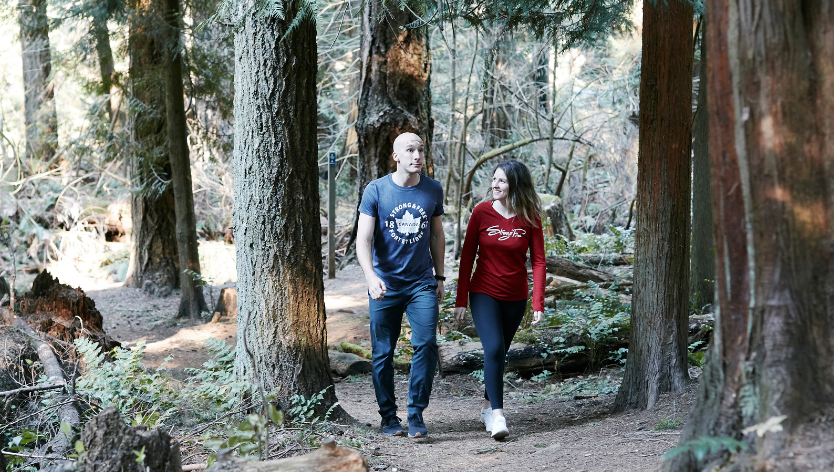 members of the Defence community walking through the woods
