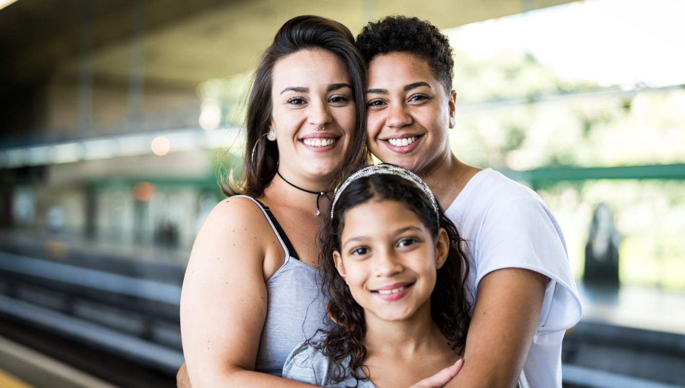 smiling couple with a kid