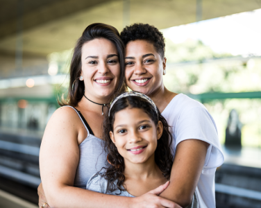 smiling couple with a kid