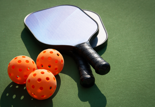 Pickleball paddles and balls