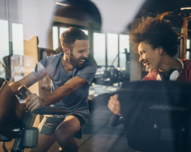 smiling people on bikes