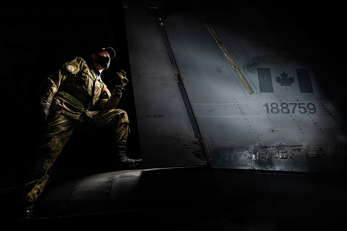 soldier inspecting an aircraft
