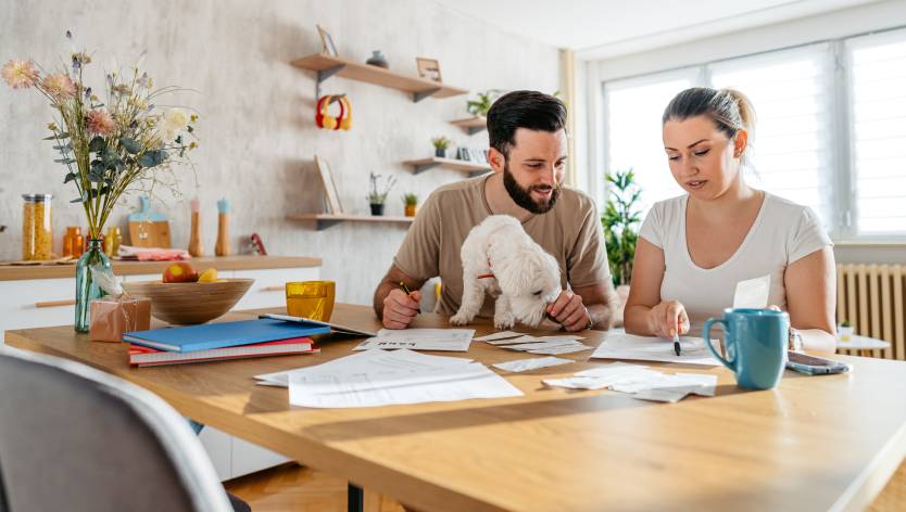 Couple and a dog at a table