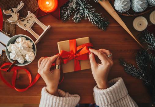 woman wrapping gift